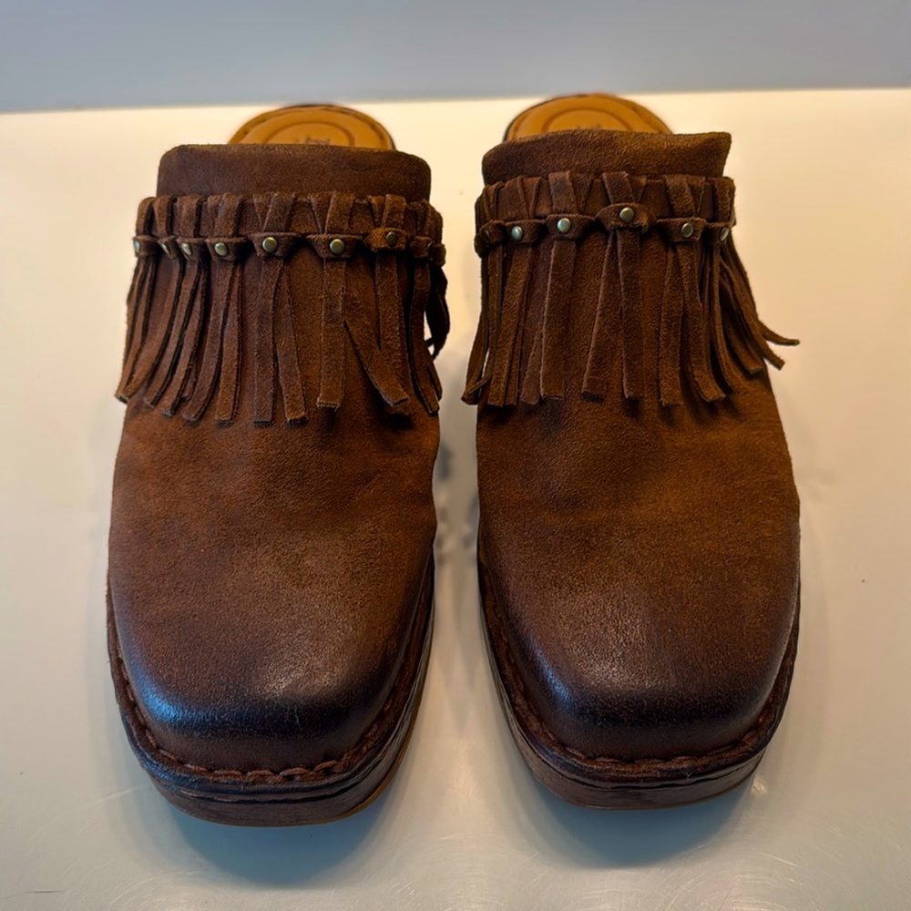 Born distressed, leather clogs.